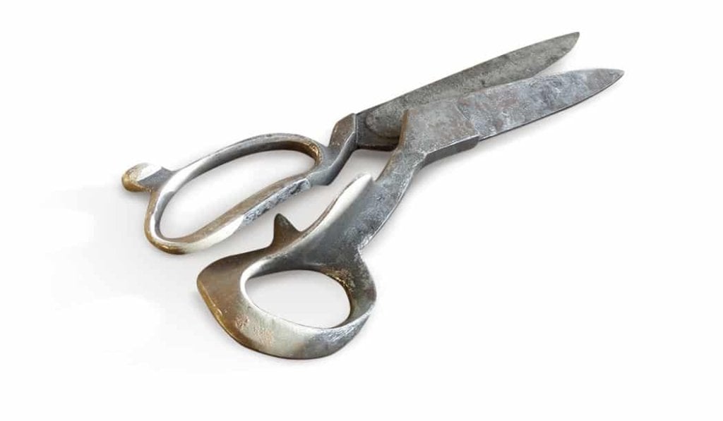 Forged scissor blanks beside a finished pair of Ernest Wright shears